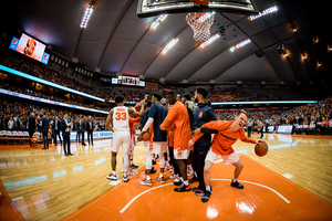 Syracuse players talk before the second half against No. 2 Virginia earlier this season.